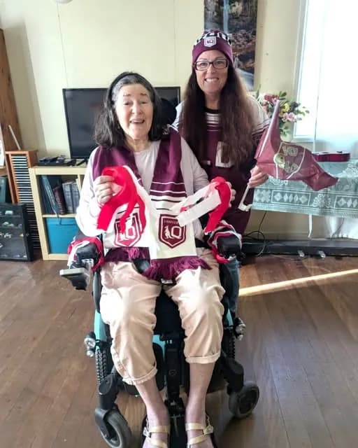 A participant and her support worker on a day out